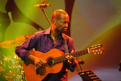 Purple shirt guitar man
